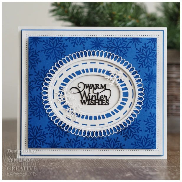 This seven-die set with a beautiful outside edge will be a great addition to your festive paper craft arsenal the die will be wonderful for card making, scrapbooking, mixed media and not just at Christmas. Packet includes card inspiration. Seven die set, largest die size 13.0 x 15.3 cm. Available at Embellish Away located in Bowmanville Ontario Canada. Card Example