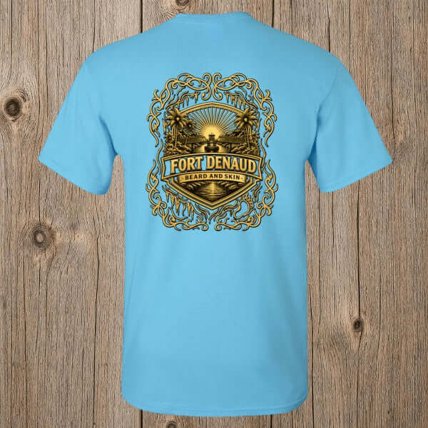 Fort Denaud Beard and Skin sky blue cotton t-shirt featuring a detailed gold and black badge graphic on the back