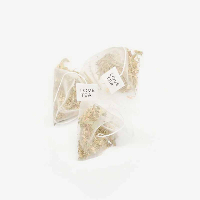 Love Tea Lemongrass & Ginger Pyramid Tea Bags, caffeine-free blend to help relieve indigestion and calm an upset stomach.