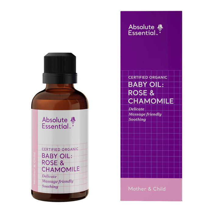 Baby oil bottle and packaging with 'Absolute Essential' branding on a white background