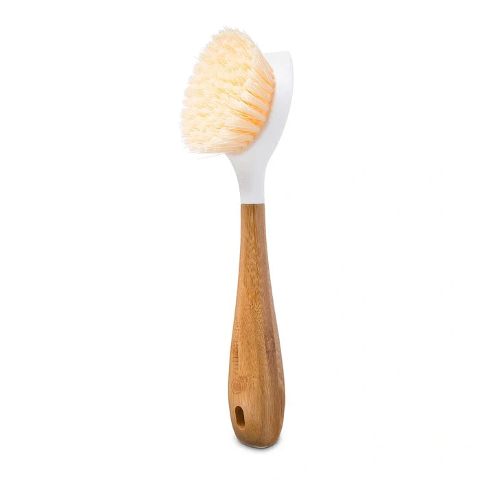 A bamboo-handled cleaning brush with a white plastic head and soft beige bristles, shown on a plain white background.