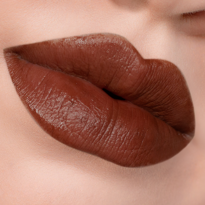 Bear with Me rich brown lipstick on lips, light skin tone close-up