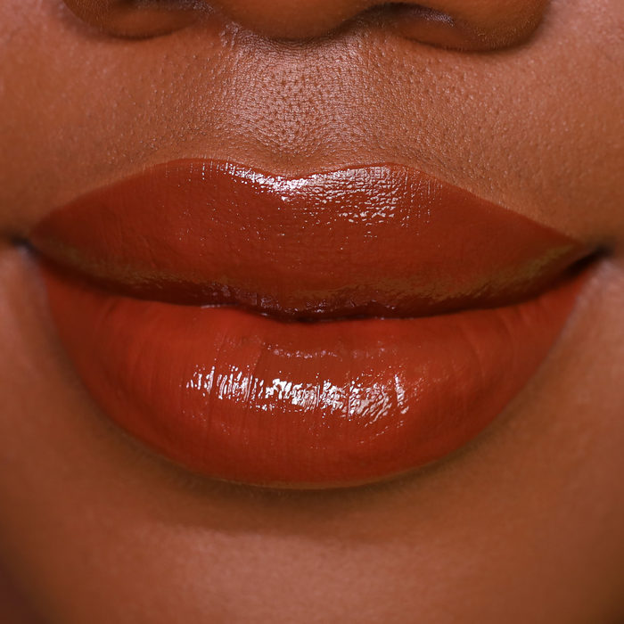 Bear with Me rich brown lipstick on lips, medium-deep skin tone