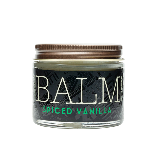 Jar of balm labeled 'Spiced Vanilla' on a white background