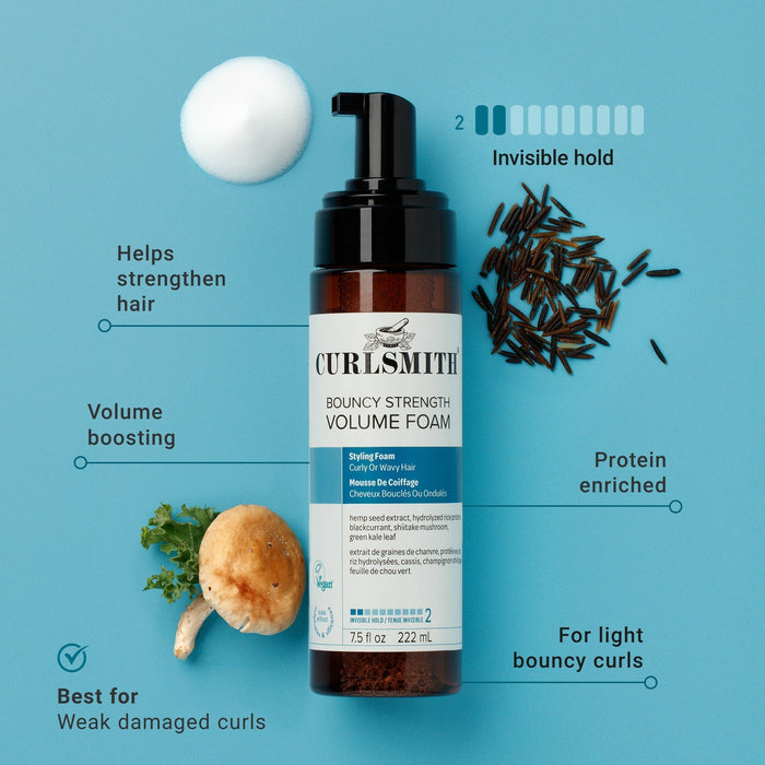 Curlsmith volume boosting foam bottle with ingredients on a blue background
