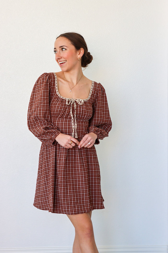 girl wearing brown peasant style dress