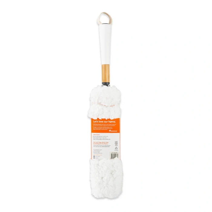 A white microfiber duster with a white plastic handle, a light wood neck, and an orange and white product label, shown against a plain white background.