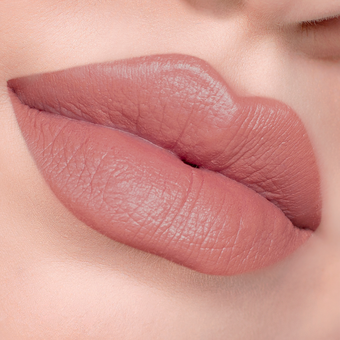 Fiesty rosy nude lipstick on lips, light skin tone close-up
