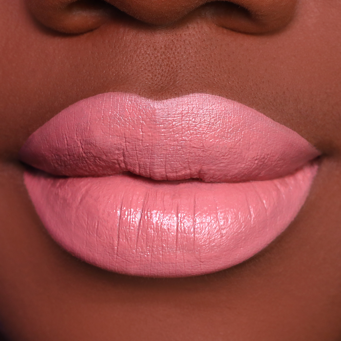 Fiesty rosy pink lipstick on lips, medium-deep skin tone