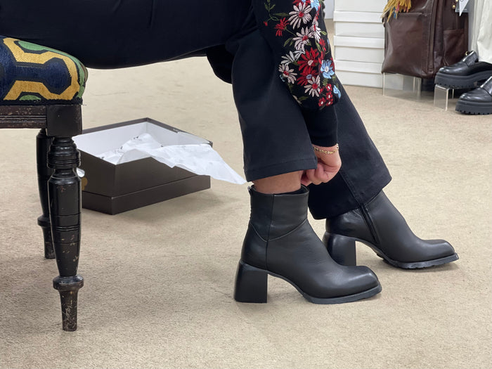 Black women's ankle boots, European made in Portugal. Mid heel height with zipper entry. Quality leather uppers, comfortable dress boot with a square toe.