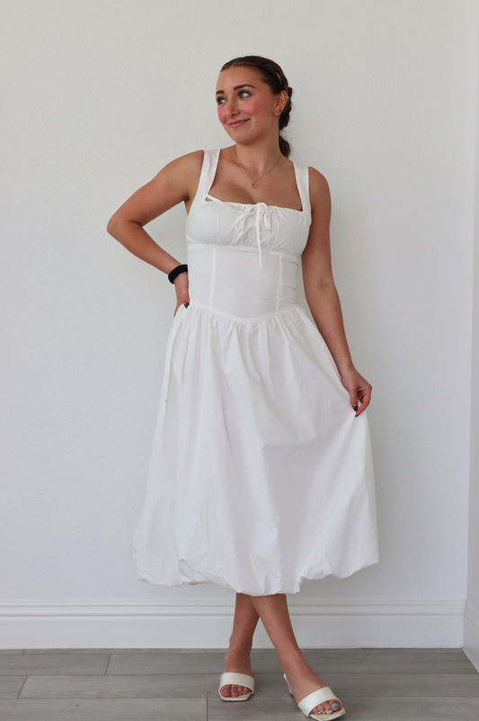 girl wearing midi length white dress