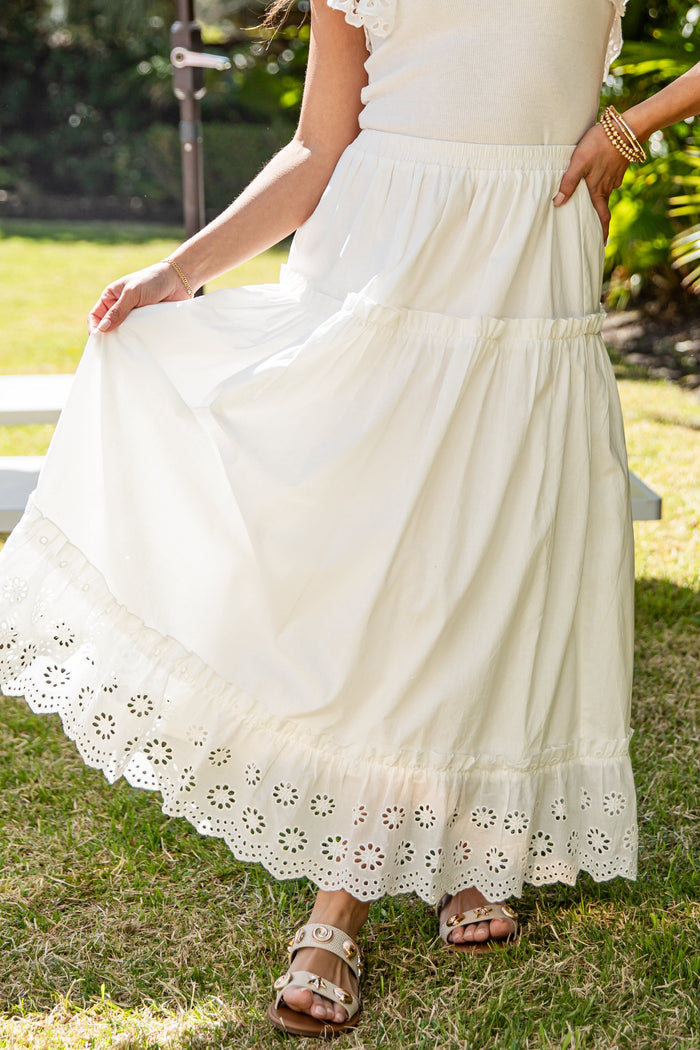 Cream eyelet lace maxi skirt styled outdoors