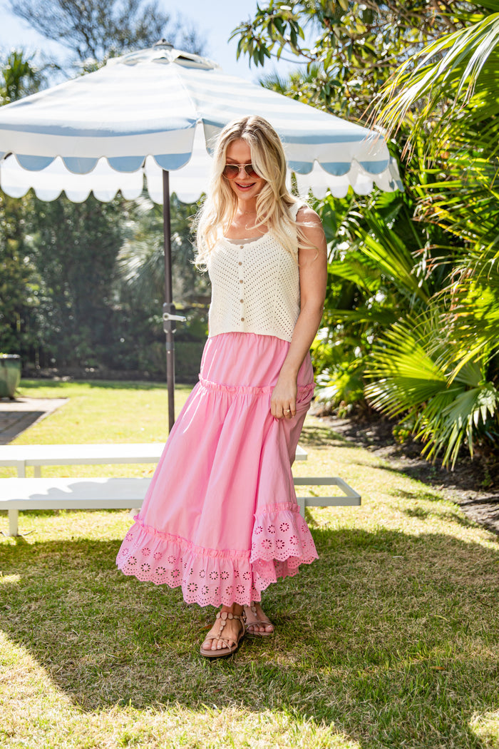 Pink tiered maxi skirt worn outdoors