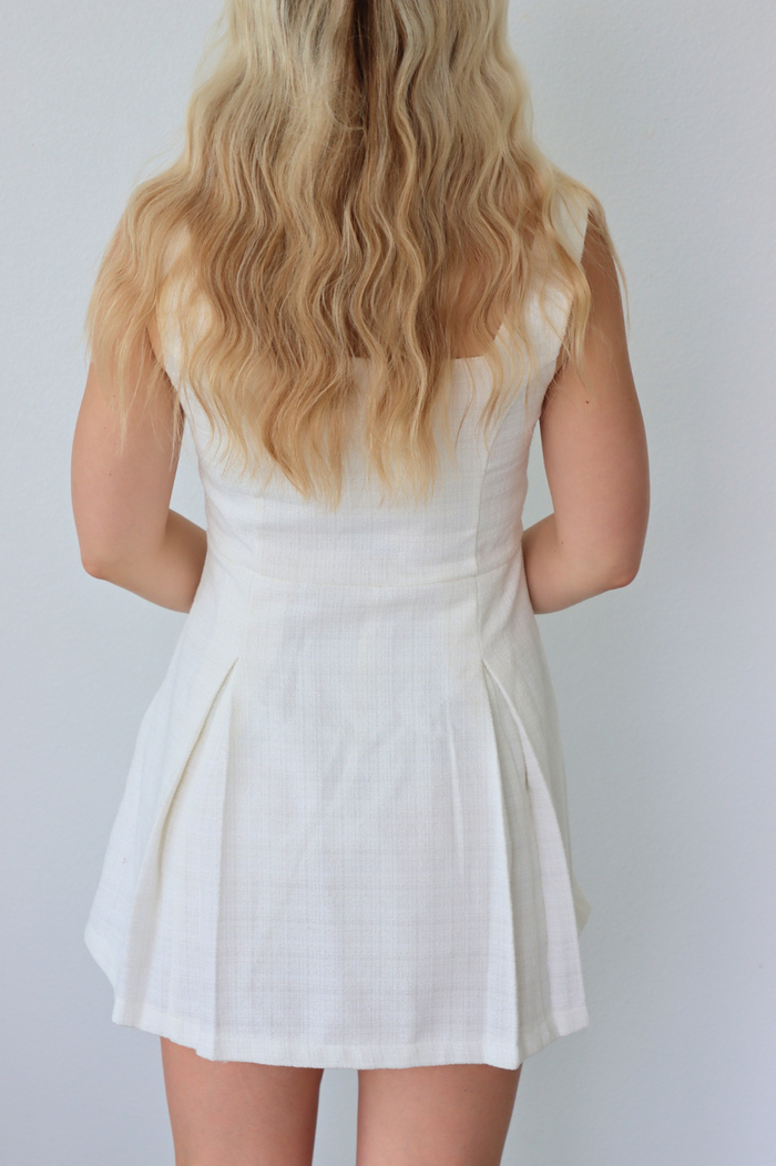girl wearing white tweed short dress