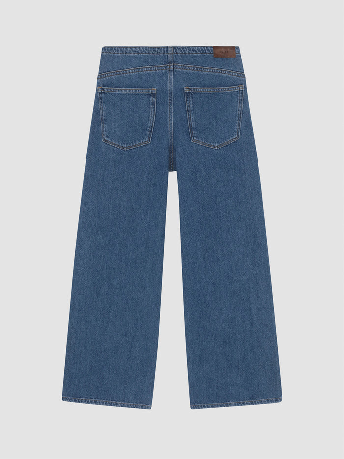 DL1961 girls' Frankie Low-Slung Wide-Leg jeans in medium blue 'Denim Dream', flat back view with leather tab.