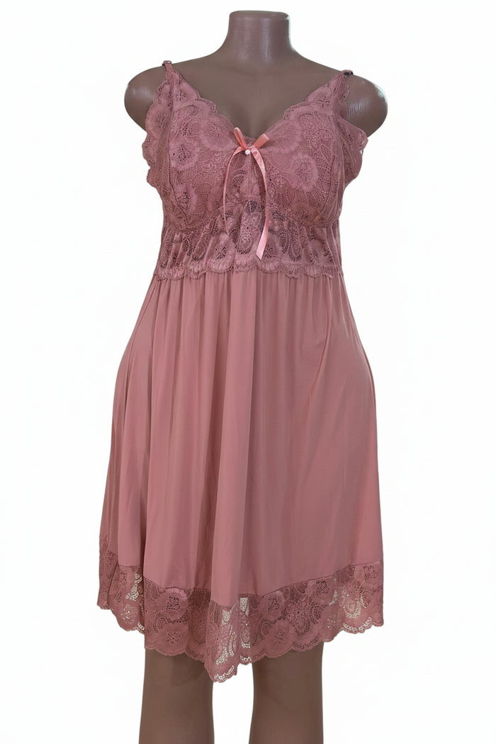 Pink lace dress close-up on white background