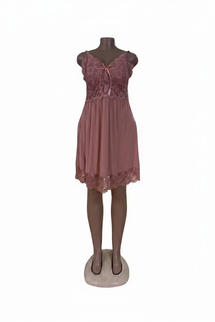 Pink lace babydoll dress on white background