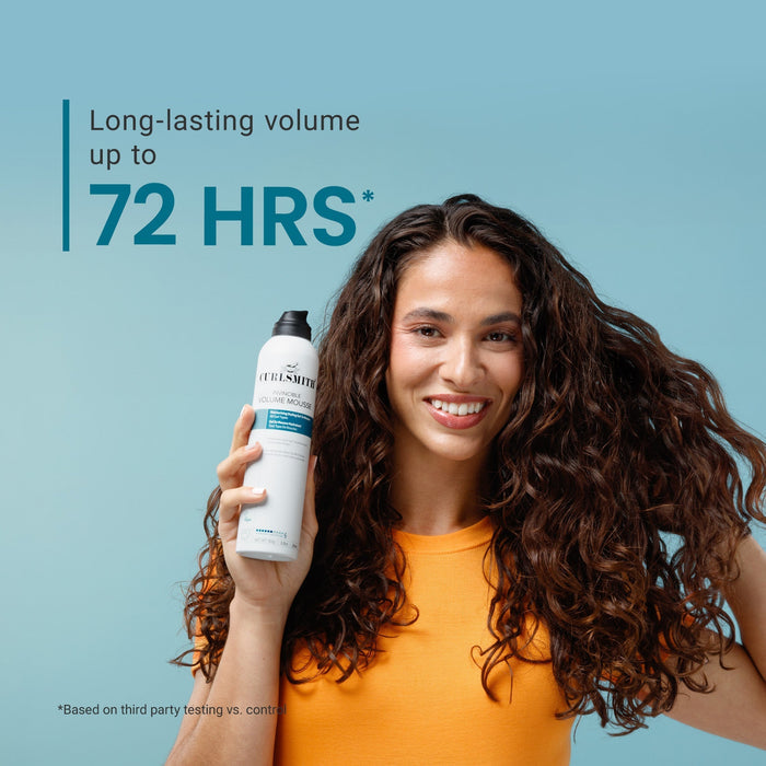 Woman holding a hair product with text about long-lasting volume on a blue background