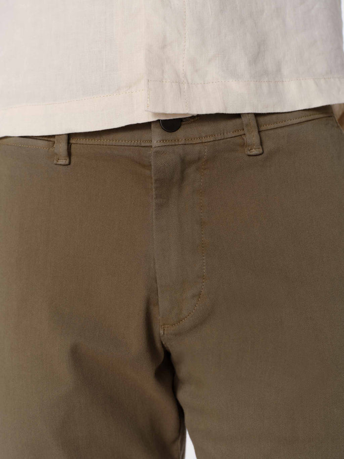DL1961 men's Jake chino short in olive green 'Belfast', close-up of front pocket and button waistband.
