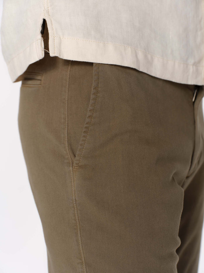 DL1961 men's Jake chino short in olive green 'Belfast', close-up detail of side pocket and hip seam.