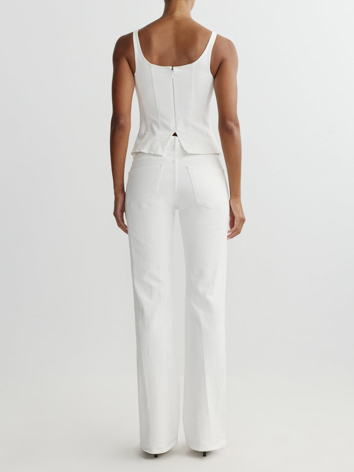 DL1961 women's Lisa denim top in white 'White', back view on model showing zip back and white jeans.