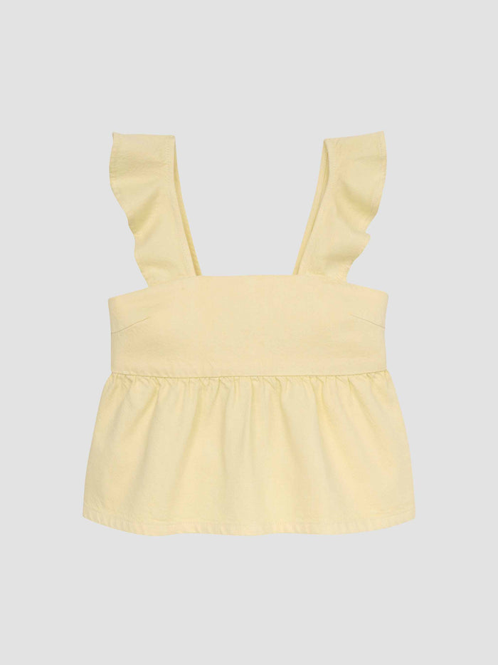 DL1961 girls' Meredyth top in pale yellow 'Sunshine' with ruffle straps and peplum hem, flat front view.