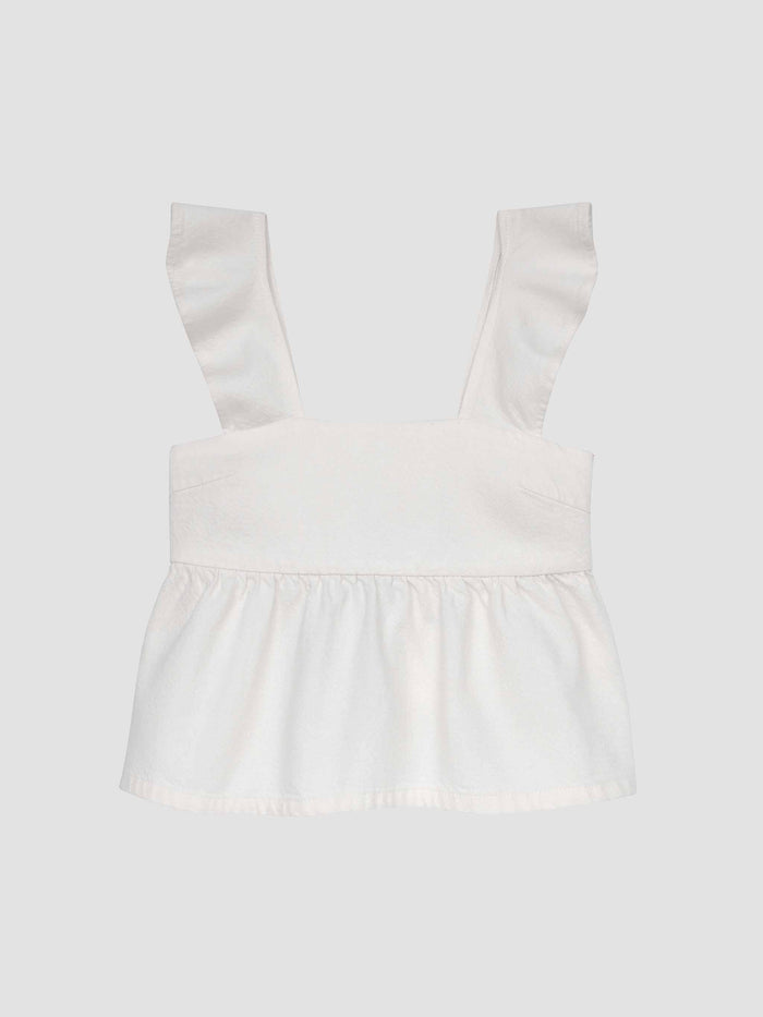 DL1961 girls' Meredyth top in white 'White' with ruffle straps and peplum hem, flat front view.