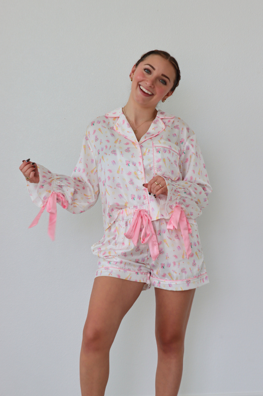 girl wearing bridal patterned silk pajama set