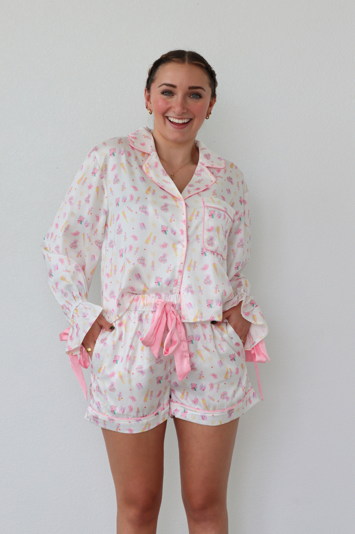 girl wearing bridal patterned silk pajama set