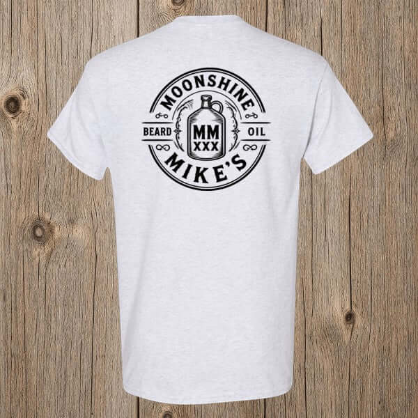 Fort Denaud Beard and Skin grey cotton t-shirt featuring a black Moonshine Mike's Beard Oil badge graphic on the back.
