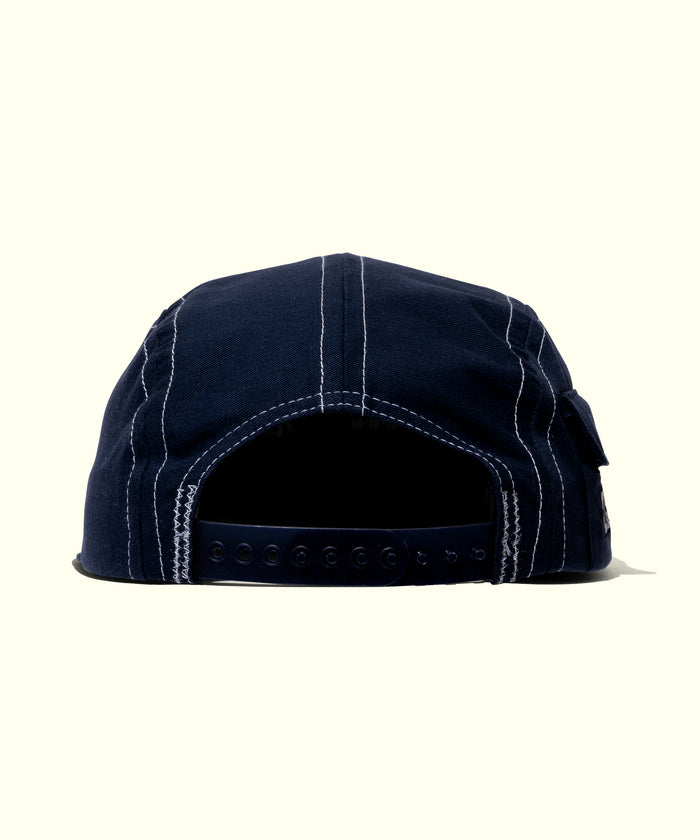 Navy blue cap with a white border on a white background