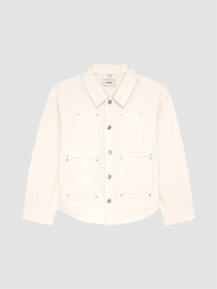 DL1961 girls' Olivia shirt in cream 'Sugar Cookie' with patch pockets, flat front view.