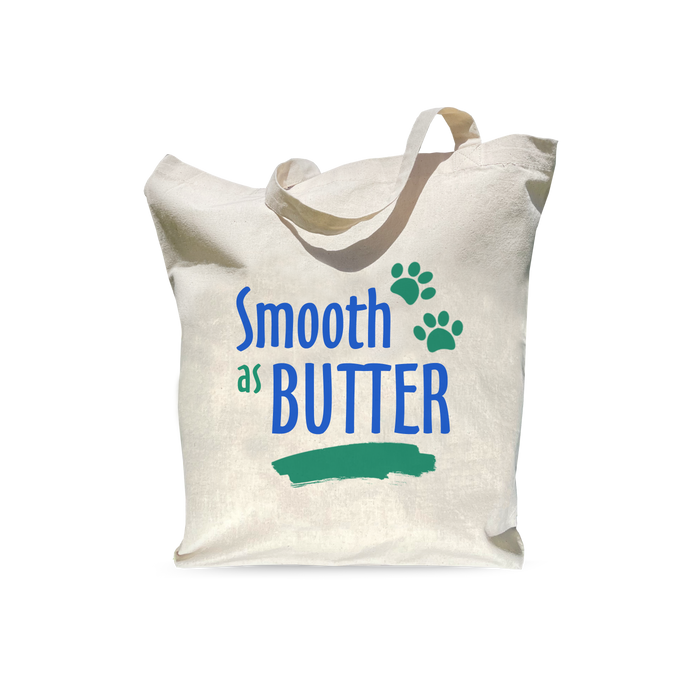 A beige reusable shopping bag with the text 'Smooth as Butter' printed on the front.
