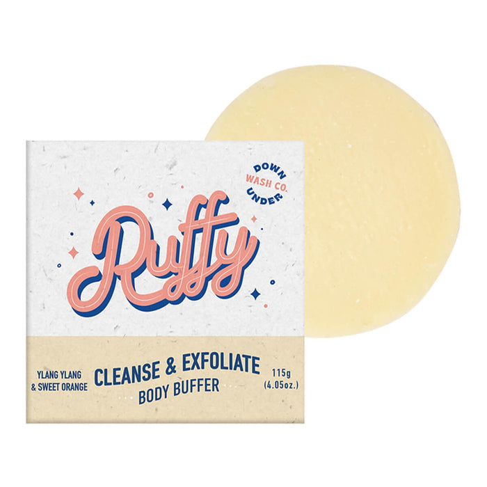 Ylang ylang and sweet orange scented body buffer bar, designed to cleanse, exfoliate and moisturise skin, next to its box.