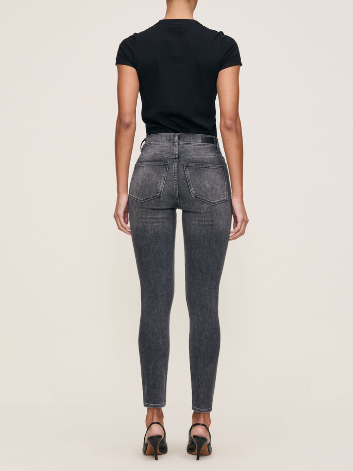 DL1961 Shrunken Tee in black, crew-neck tee back view with grey skinny jeans, full-length rear shot.