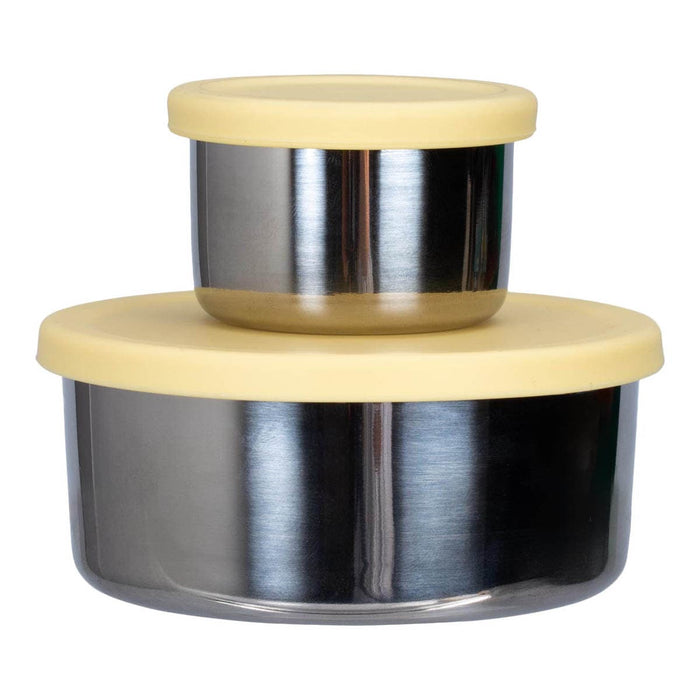 Close up of 2 snack pods stacked on top of each other with yellow silicone lids.