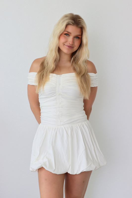 girl wearing white off the shoulder dress