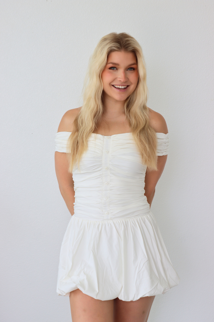 girl wearing white off the shoulder dress
