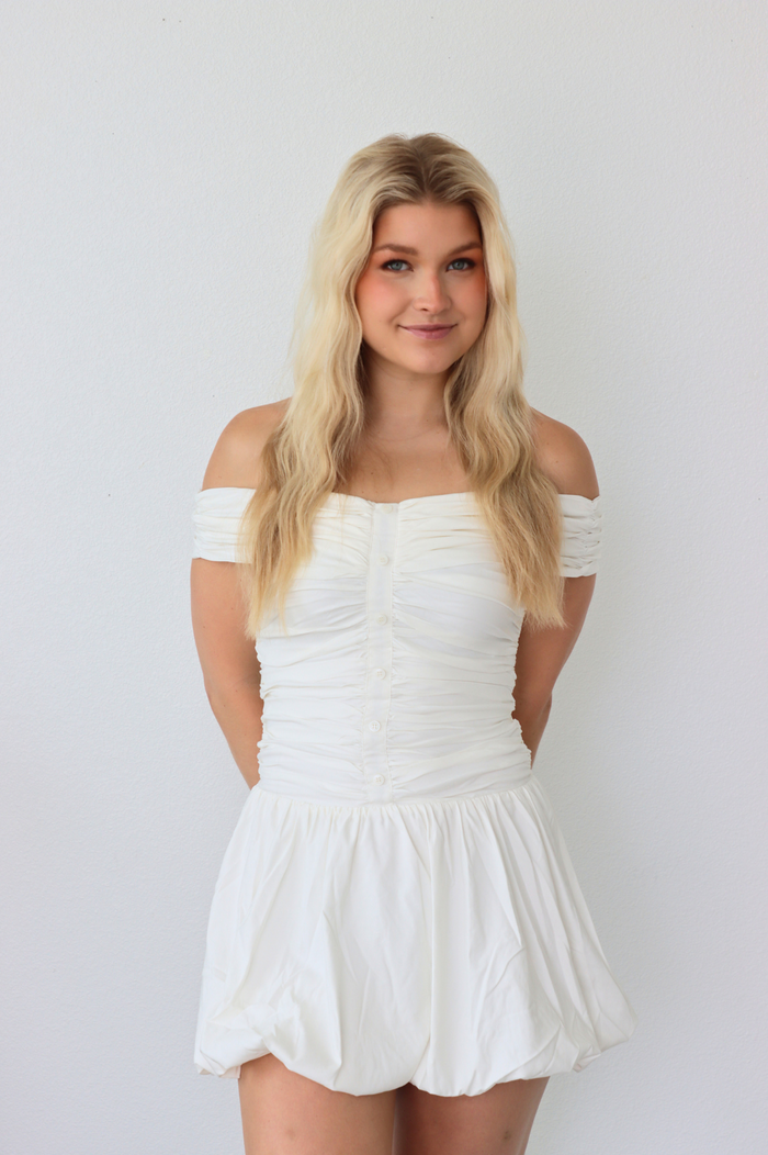 girl wearing white off the shoulder dress